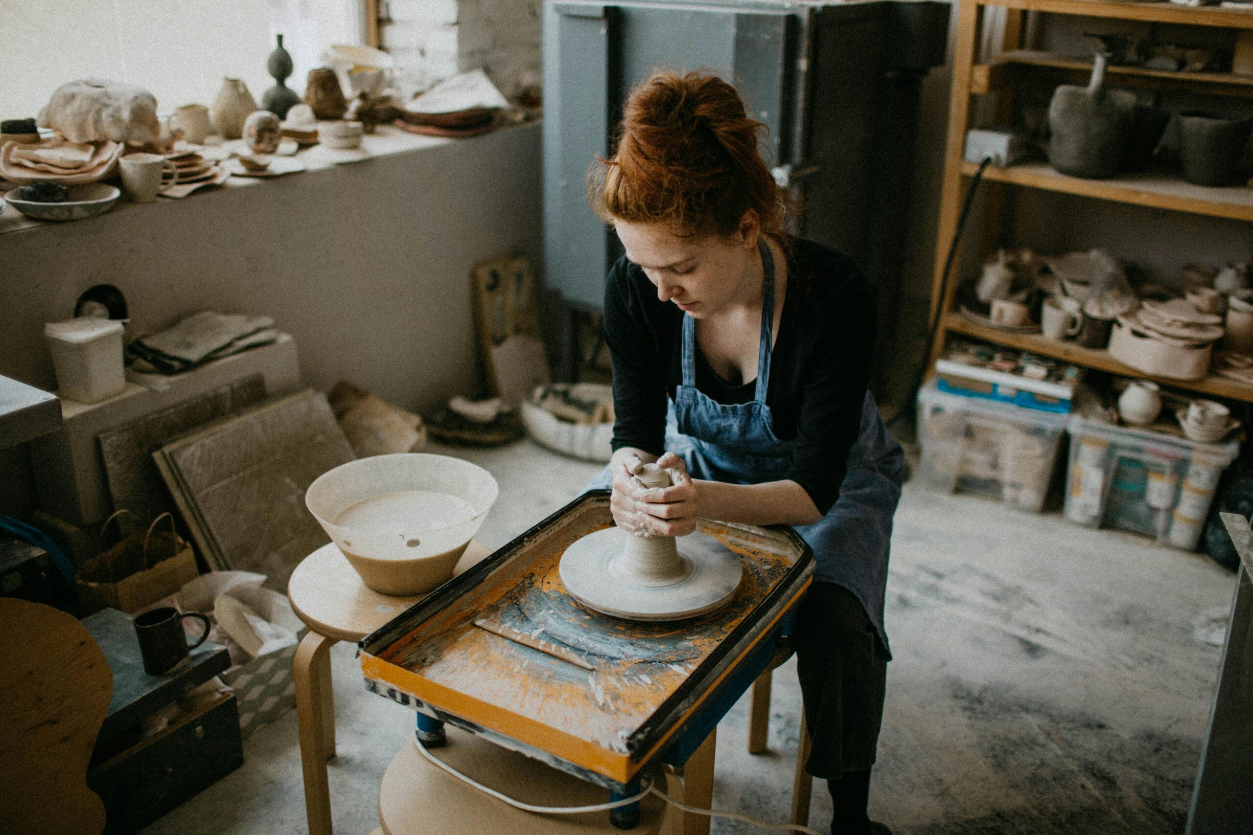 MM working with clay and ink